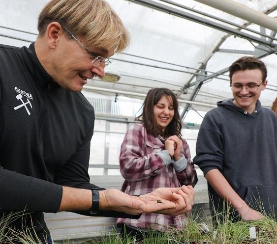 Professor Robert Pal teaching in a greenhouse